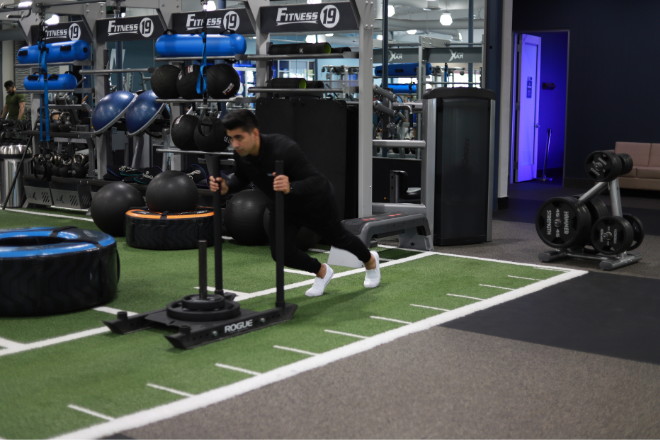 Man using fitness sled