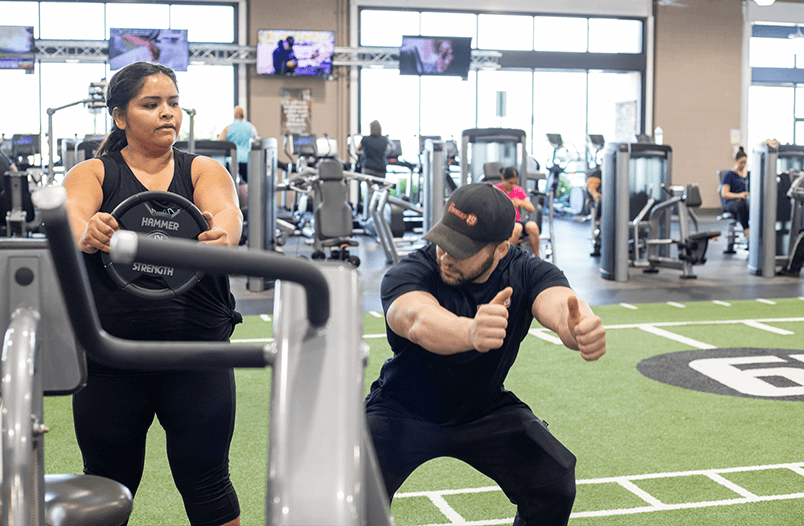 Personal trainer and client working out